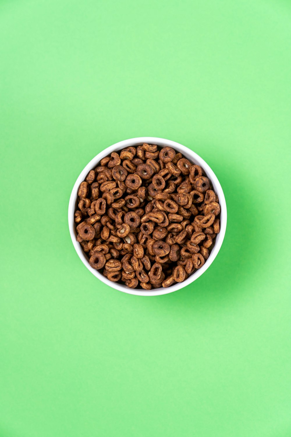 a bowl of cereal on a green background