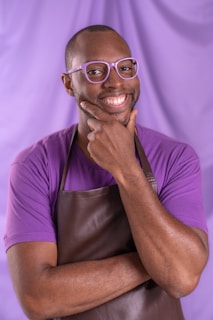 A cool purple cow wearing sunglasses.