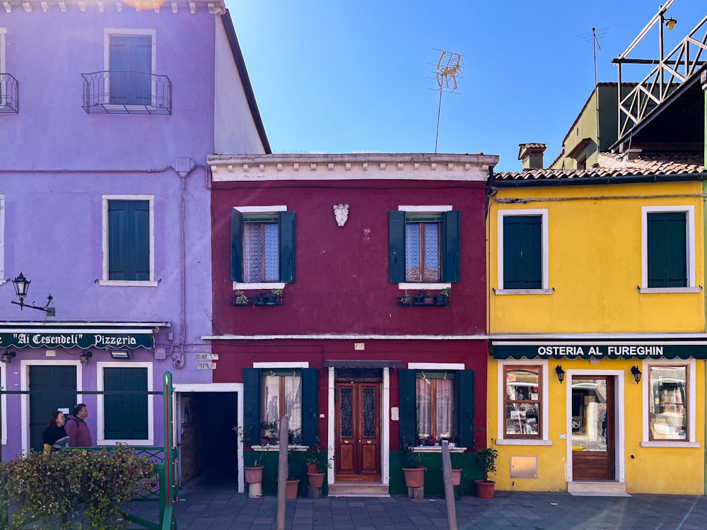 a row of colorful buildings sitting next to each other