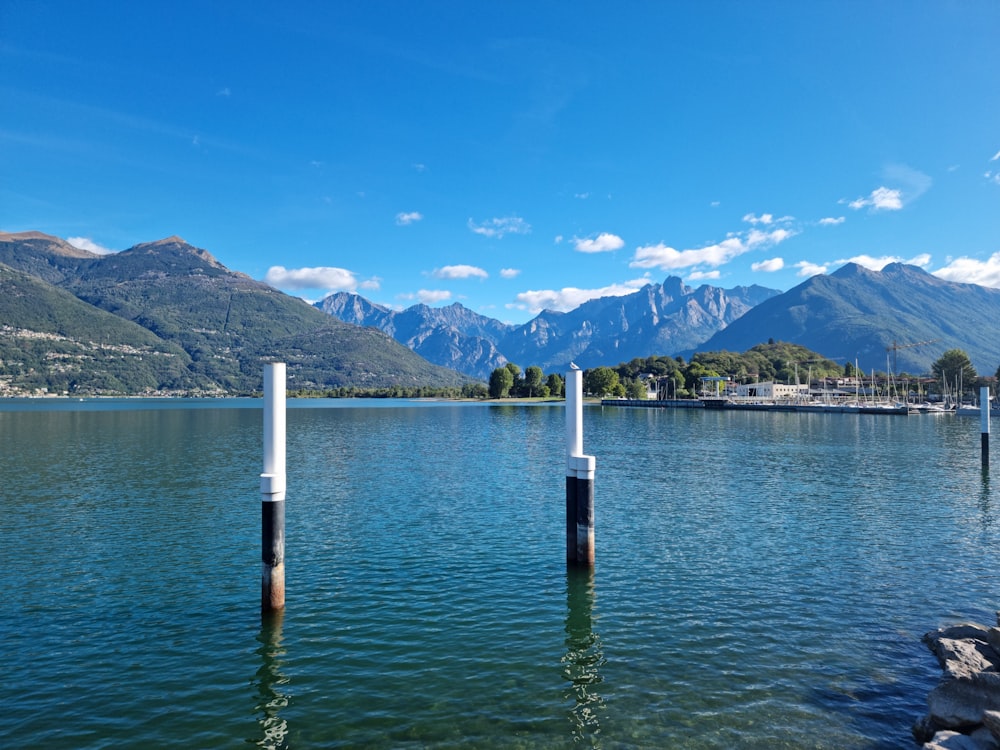 a body of water with mountains in the background