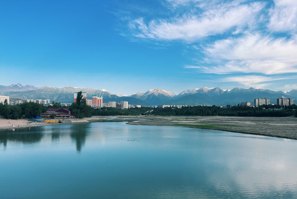 a large body of water with a city in the background