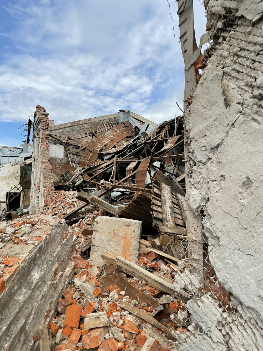 a pile of rubble sitting next to a building