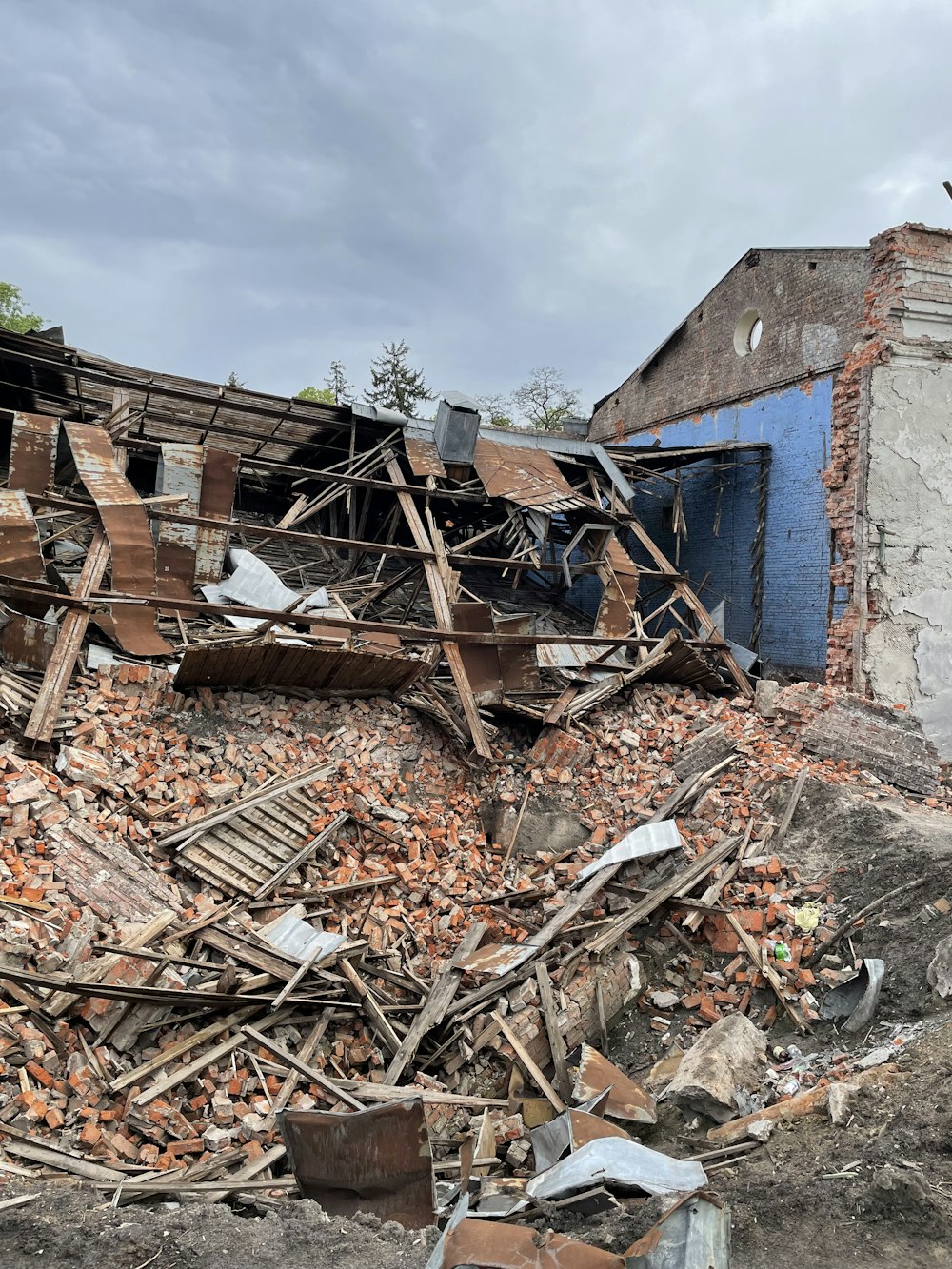 a pile of rubble next to a building