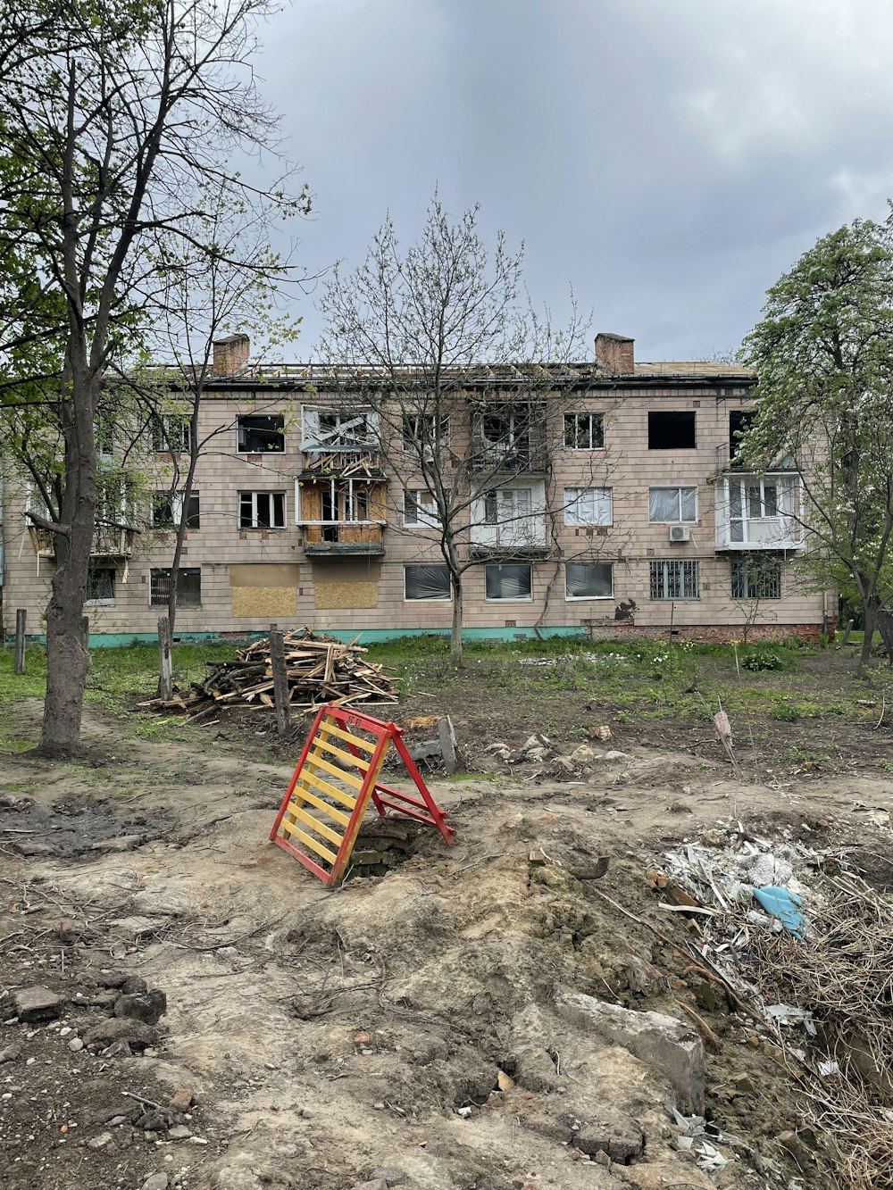 an abandoned building with a broken down ladder