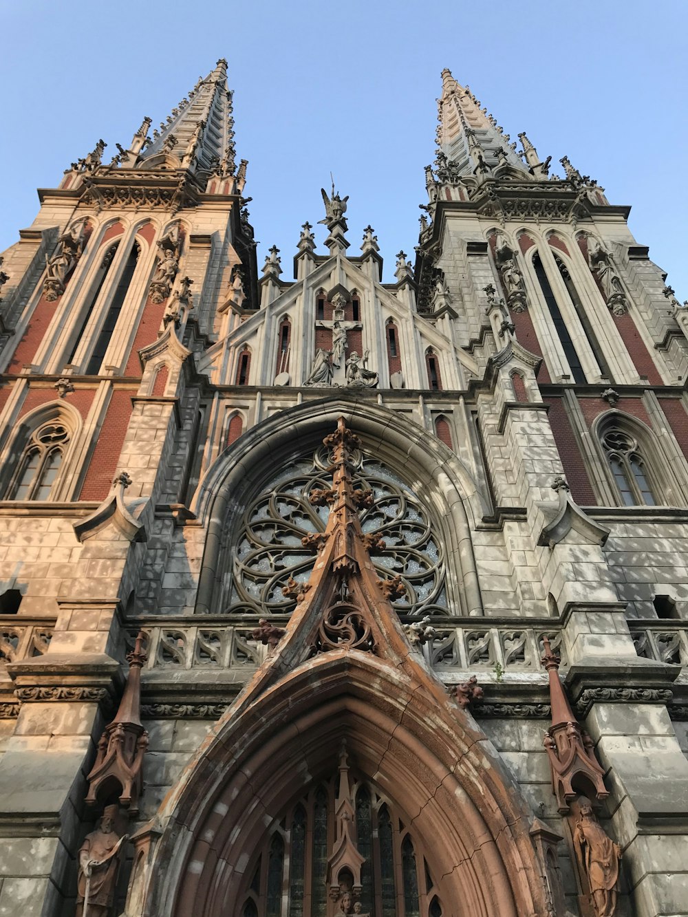 a large cathedral with a clock on the front of it