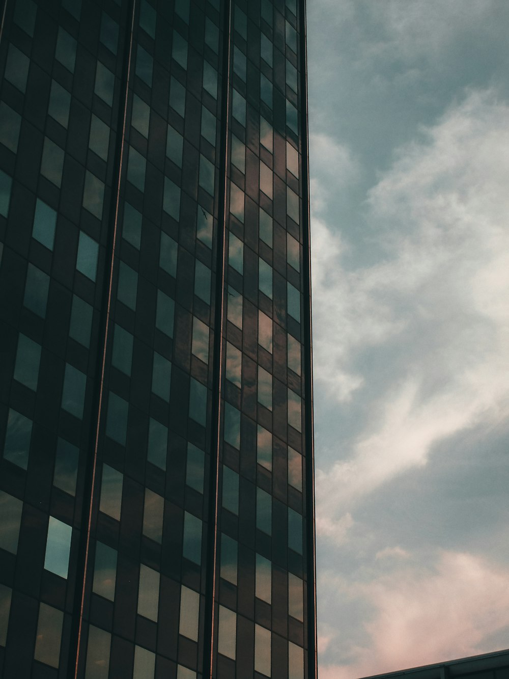 a tall building with a clock on the side of it