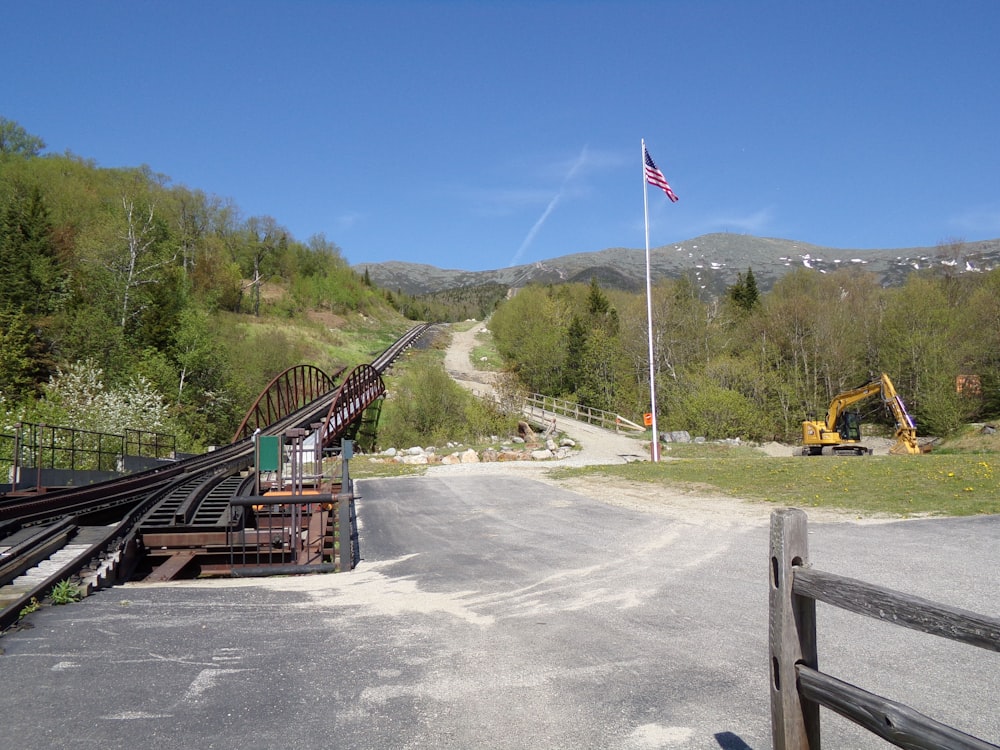 a train track with a flag on top of it