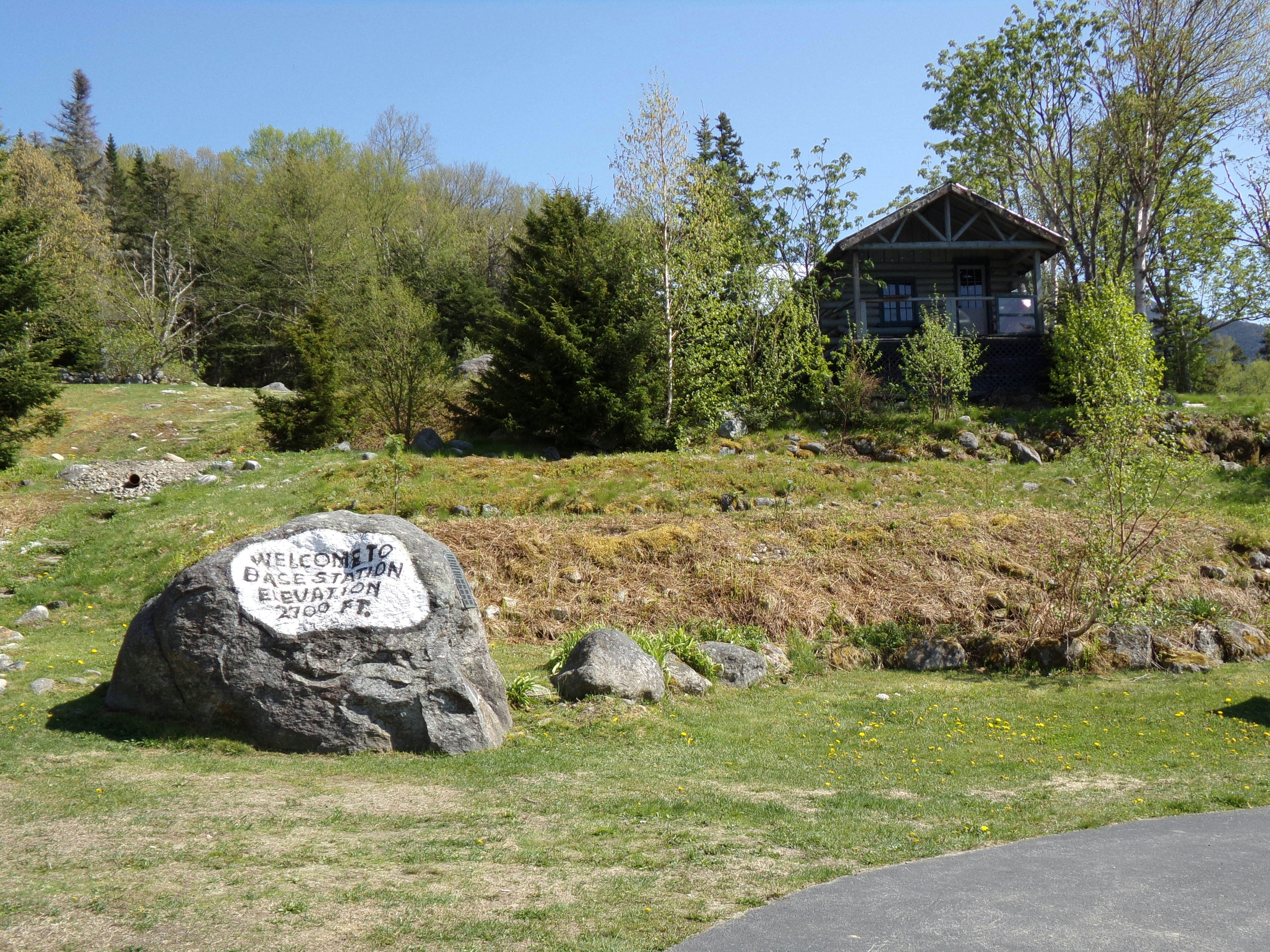 a large rock sitting in the middle of a field