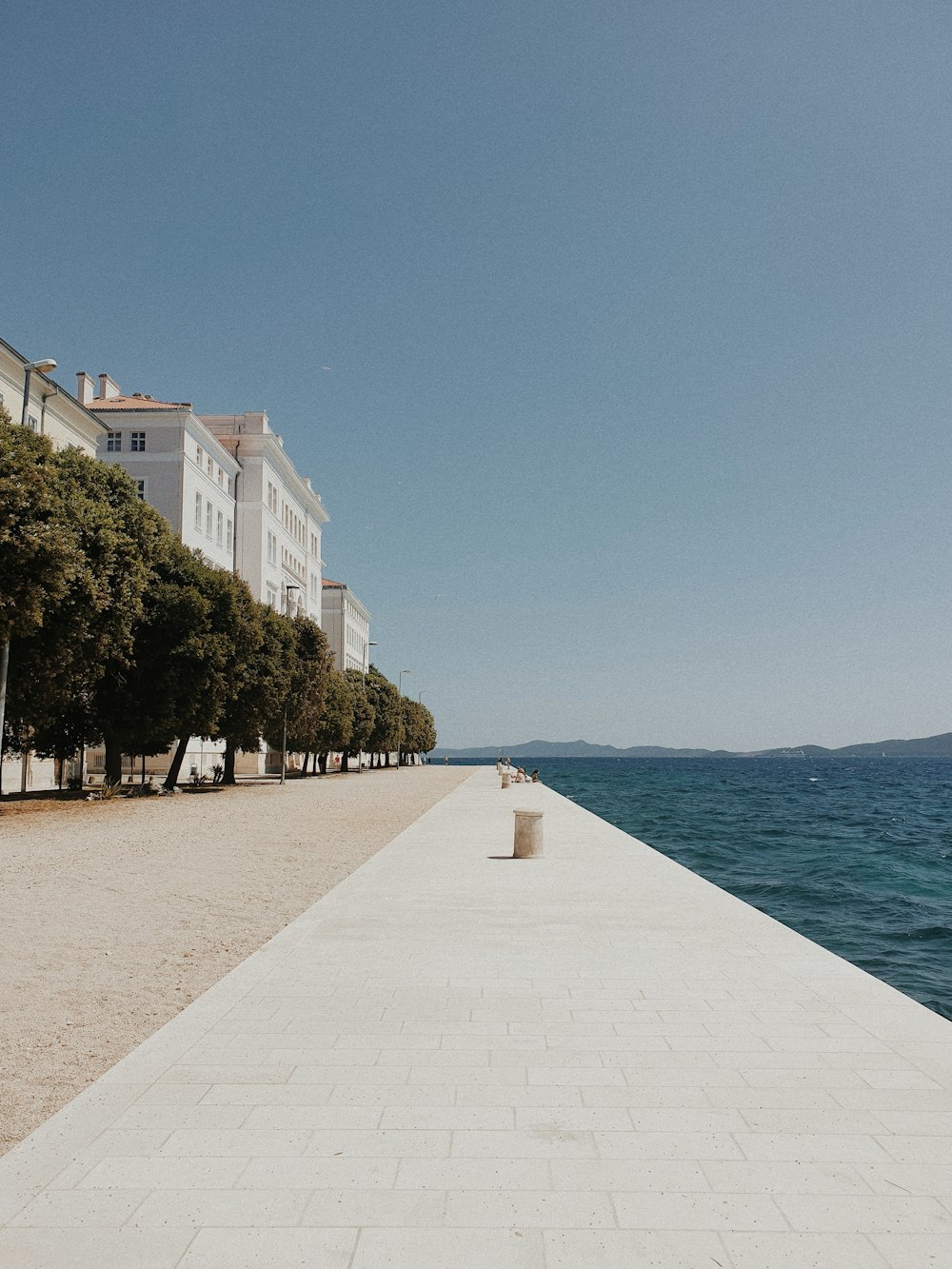 a view of the ocean from a long pier