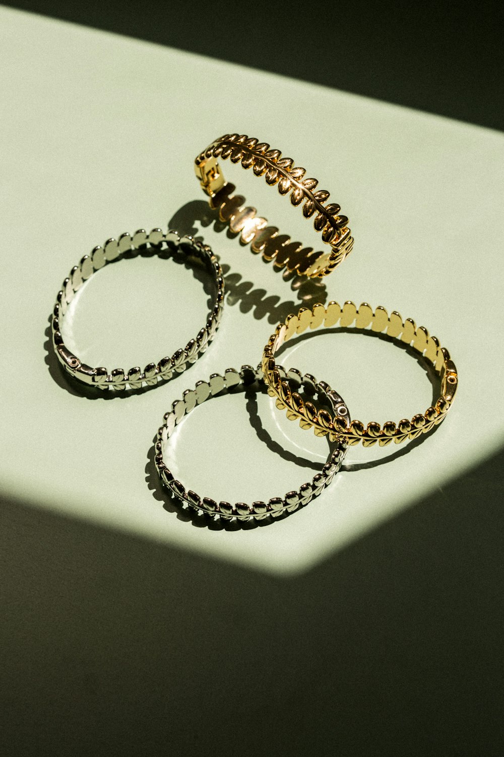 a group of three rings sitting on top of a table