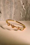 a close up of a gold ring on a table