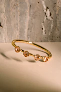 a close up of a gold ring on a table