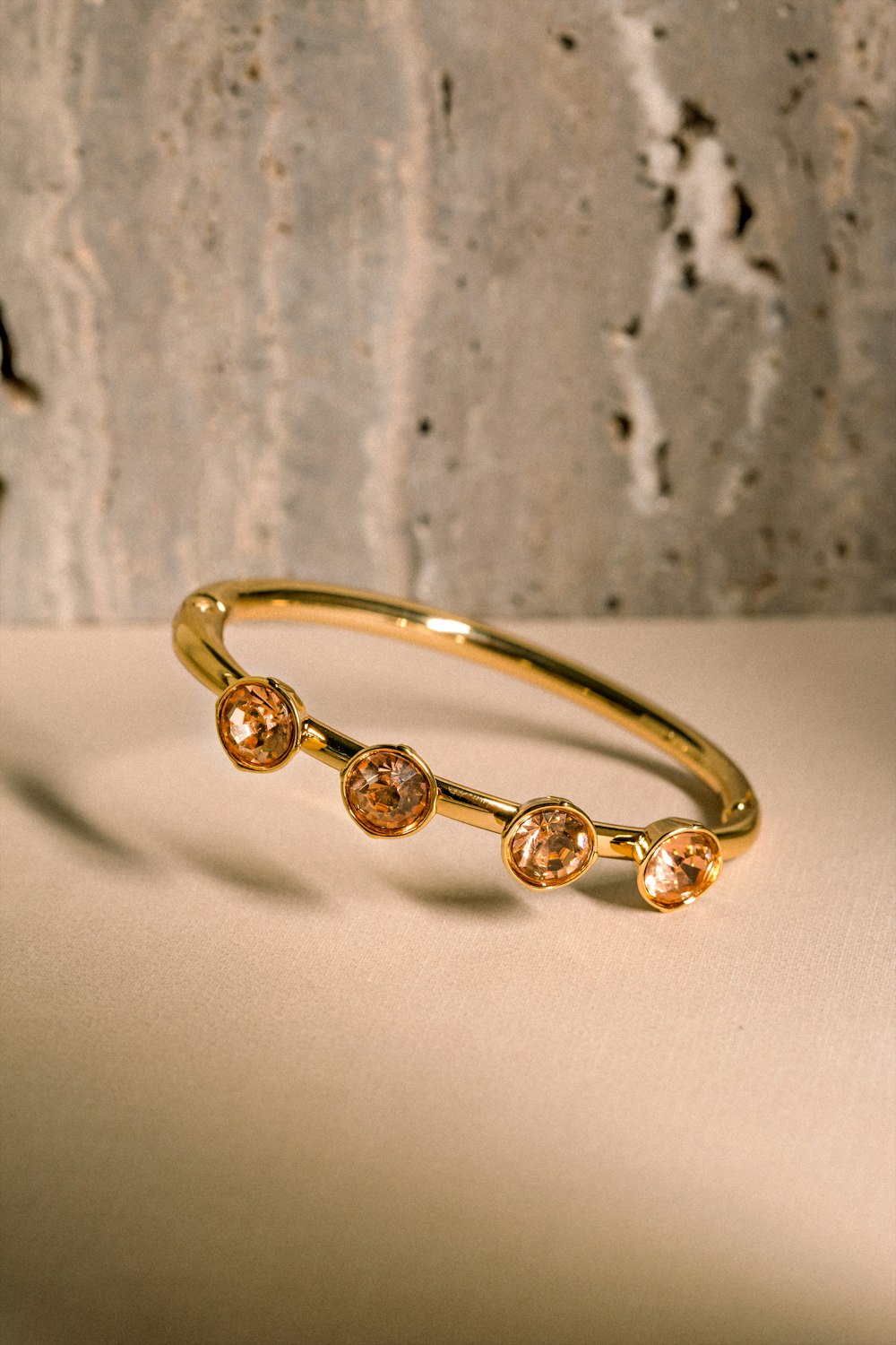 a close up of a gold ring on a table