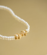 A delicate gold necklace with a newly fixed clasp resting on a velvet cloth.