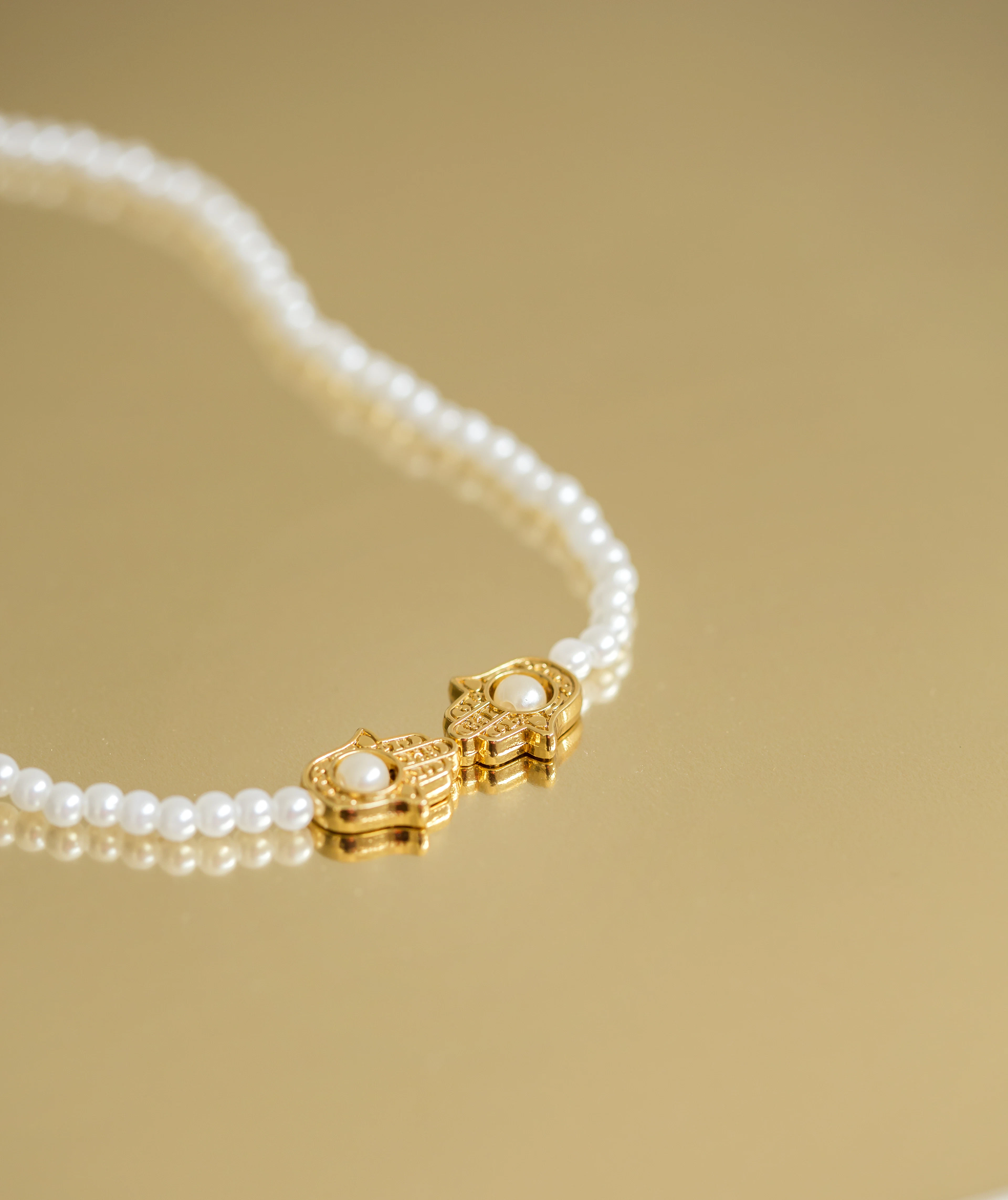 Lustrous freshwater pearls and colourful gemstones displayed together