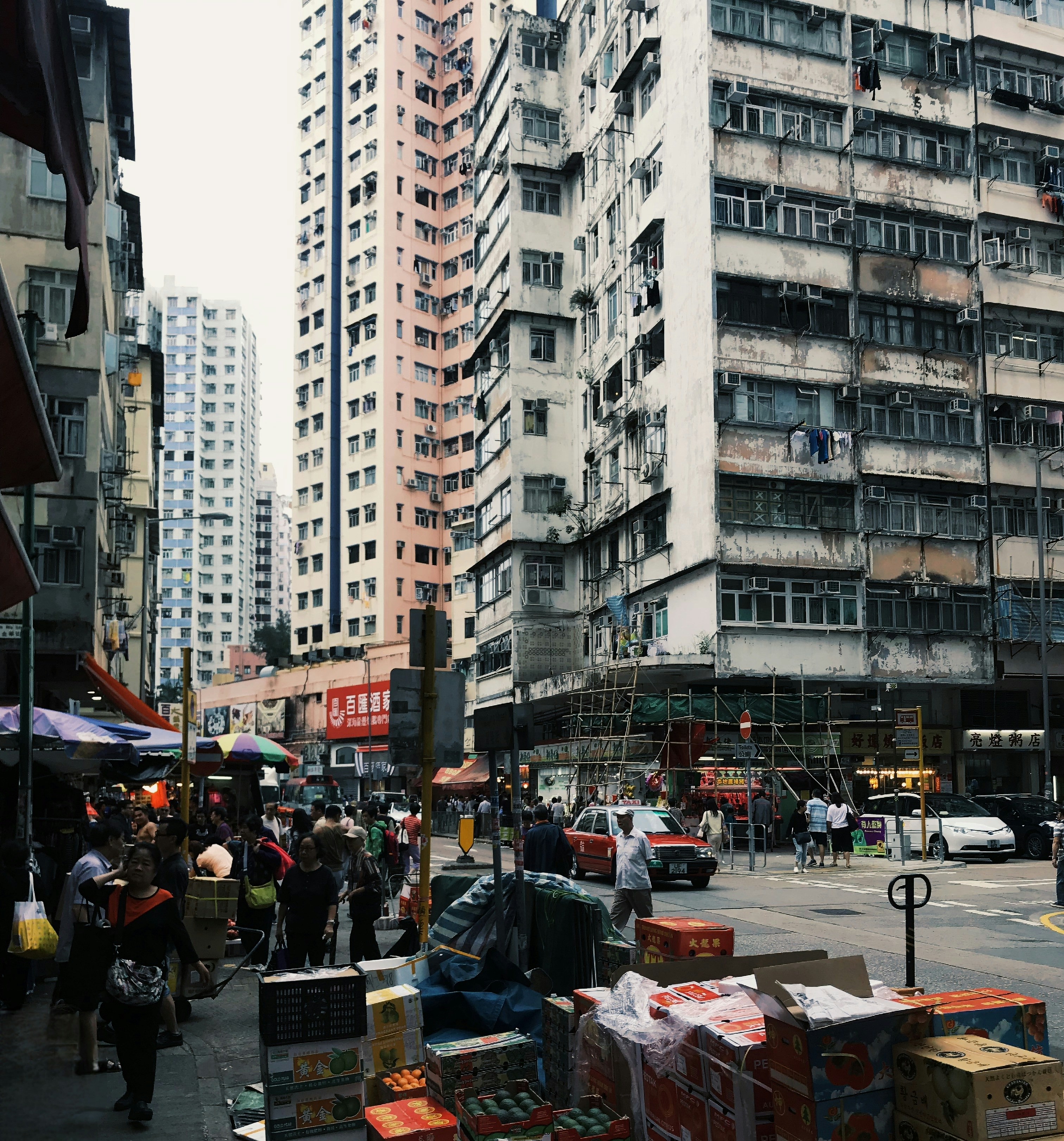 Busy City Street Filled with Lots of Tall Buildings