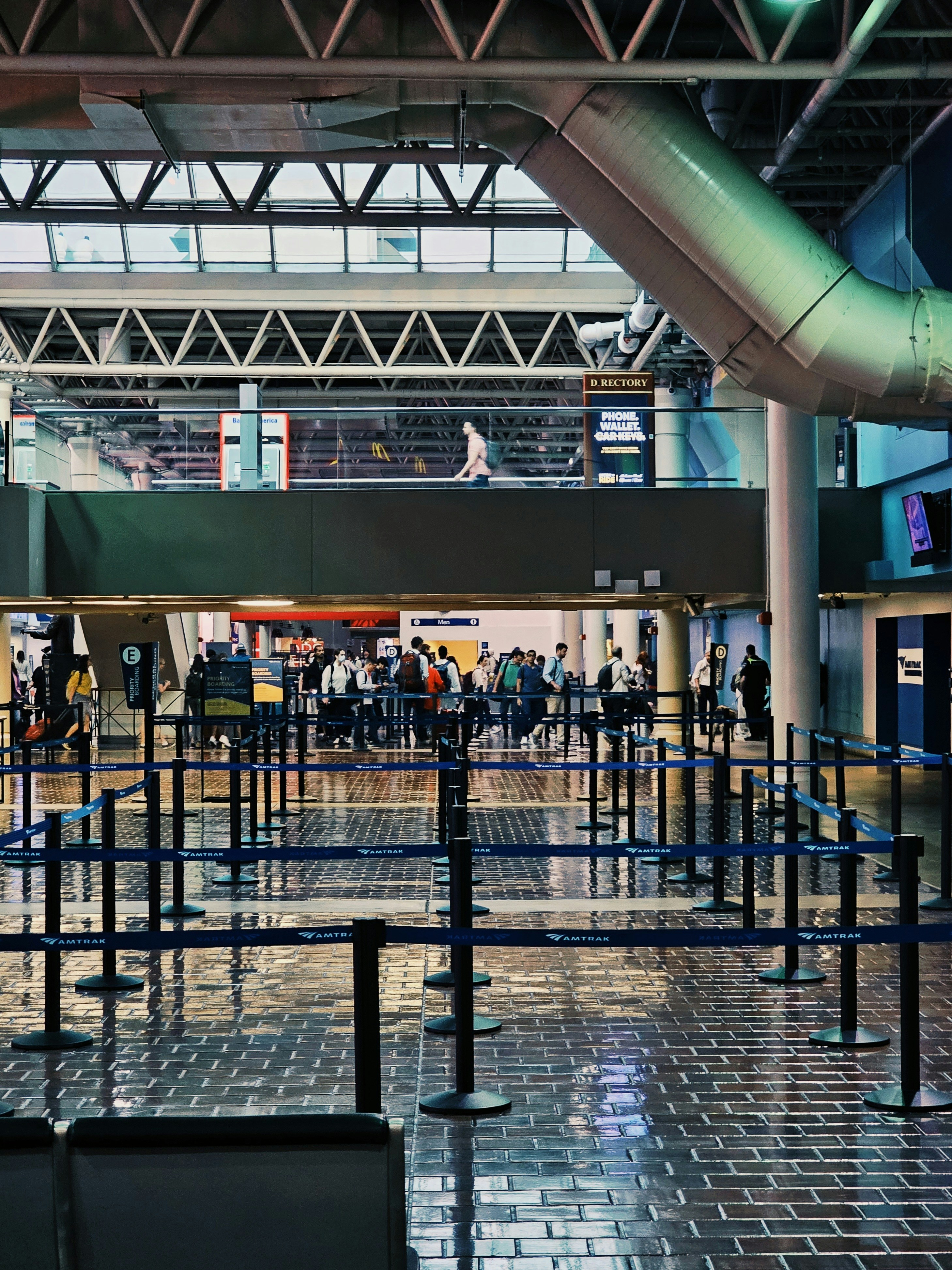 a group of people standing around in an airport