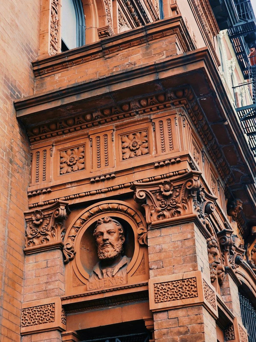 a building with a statue of a man on the front of it