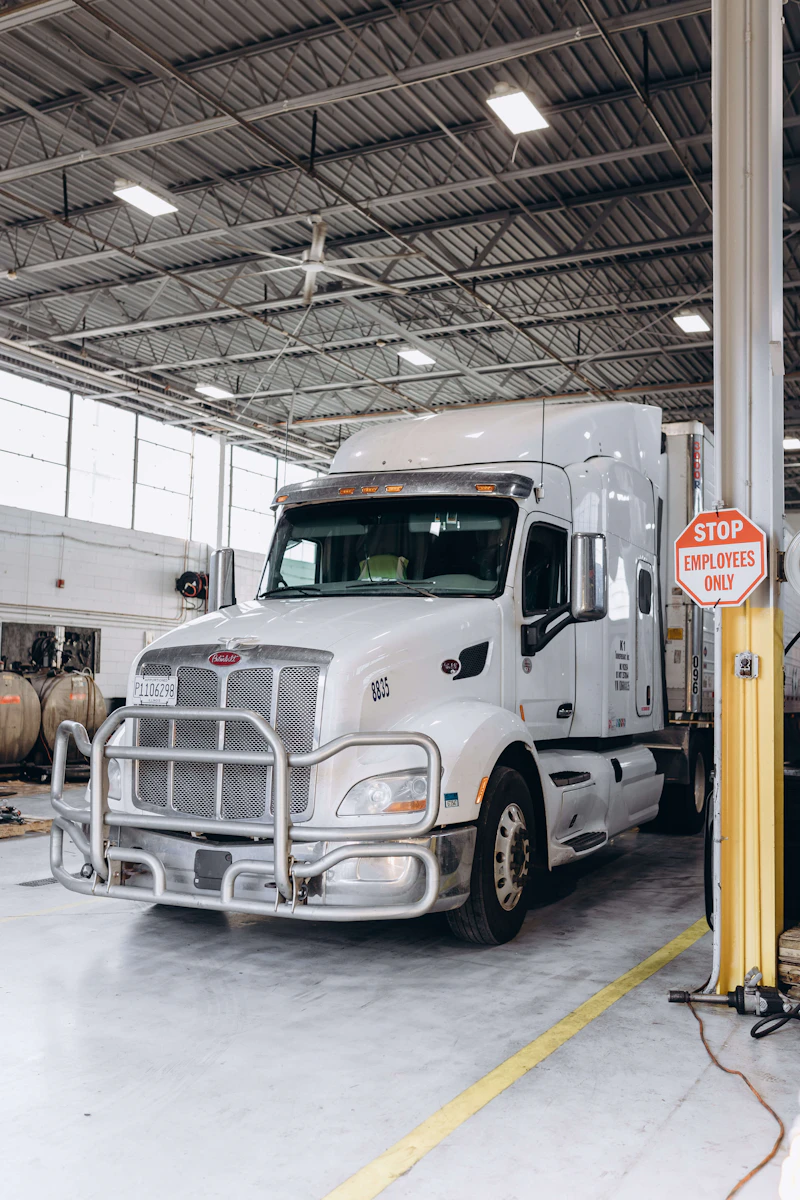 Semi truck parked in a commercial service bay