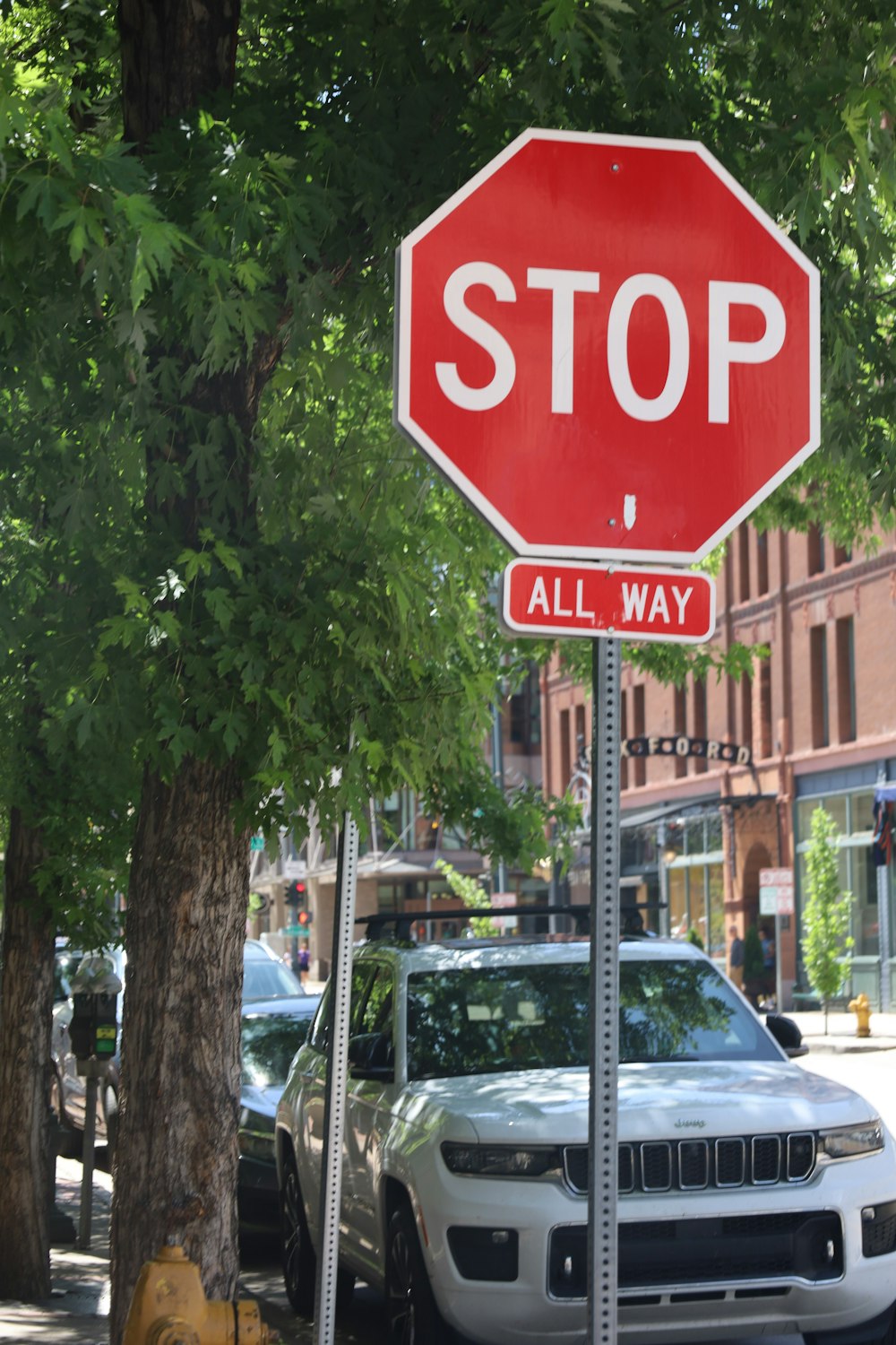 a red stop sign sitting on the side of a road