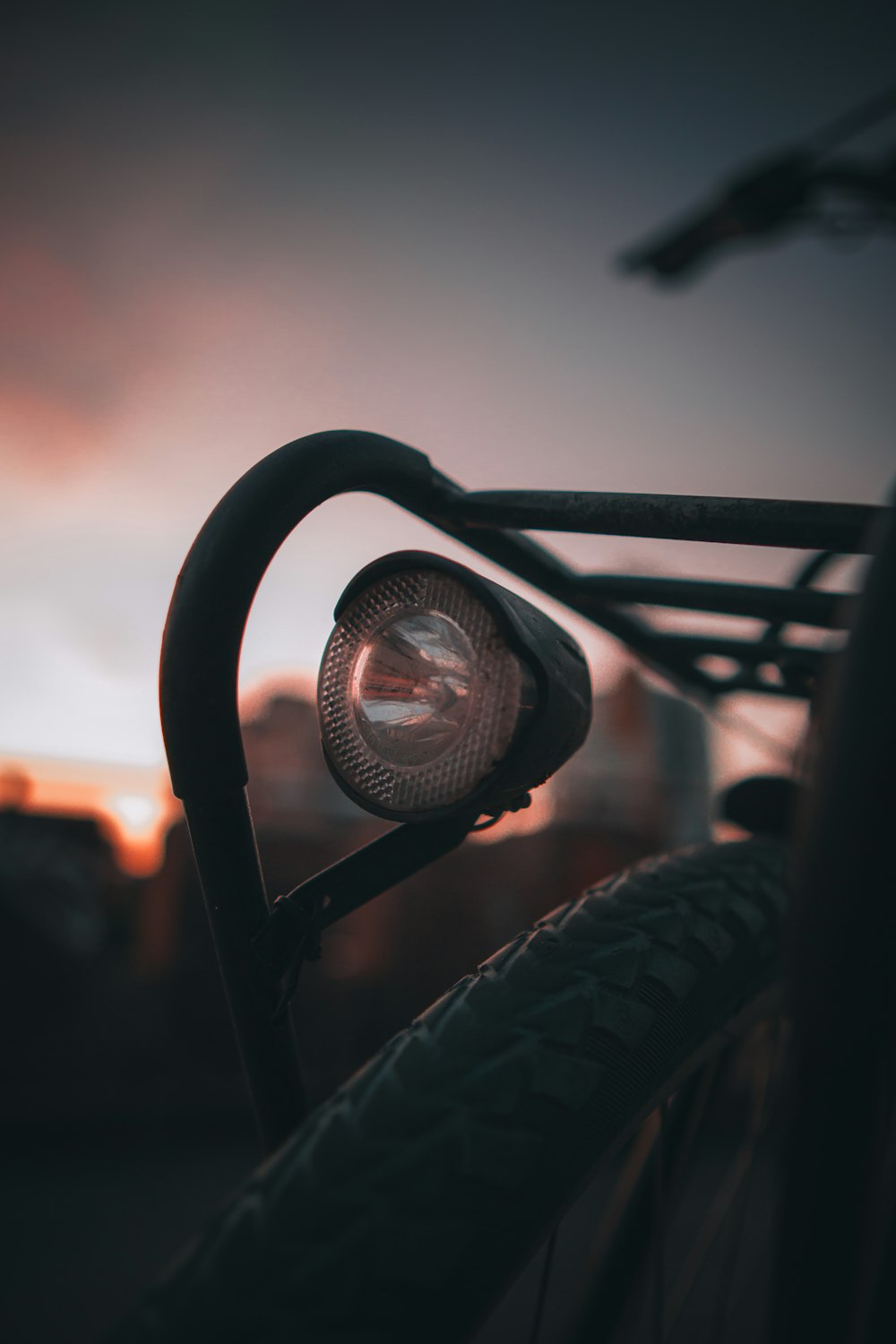 a close up of a bicycle light on a bike