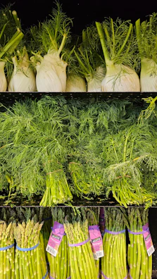 Rows of organic vegetables neatly stacked on wooden shelves.