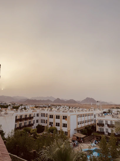 Panoramic view of Bogotá city skyline from an elegant event hall at Club La Aguadora during sunset.
