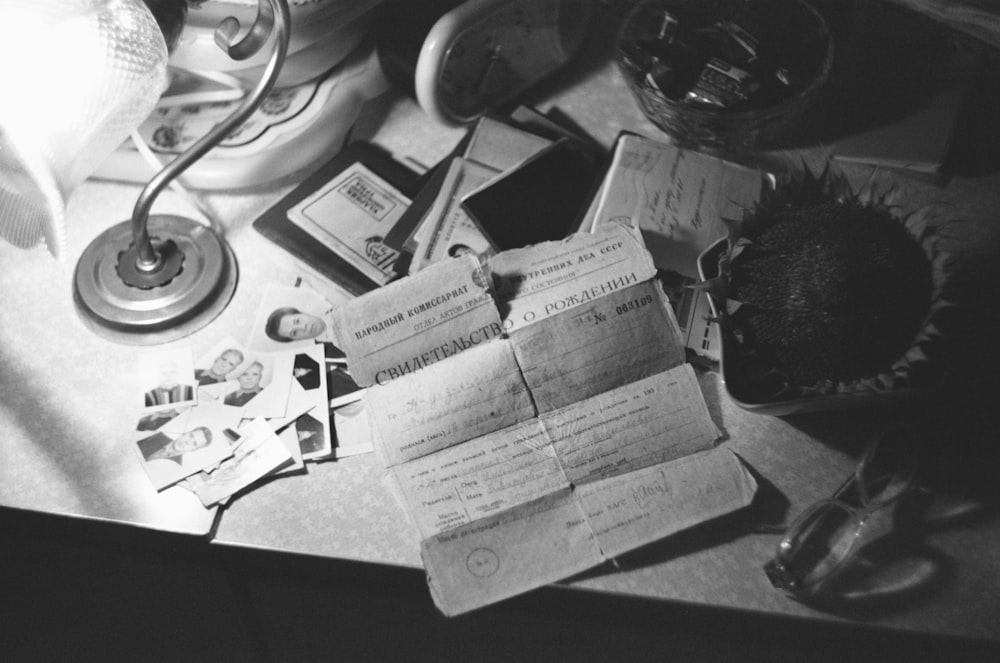 a cluttered desk with papers and a stethoscope