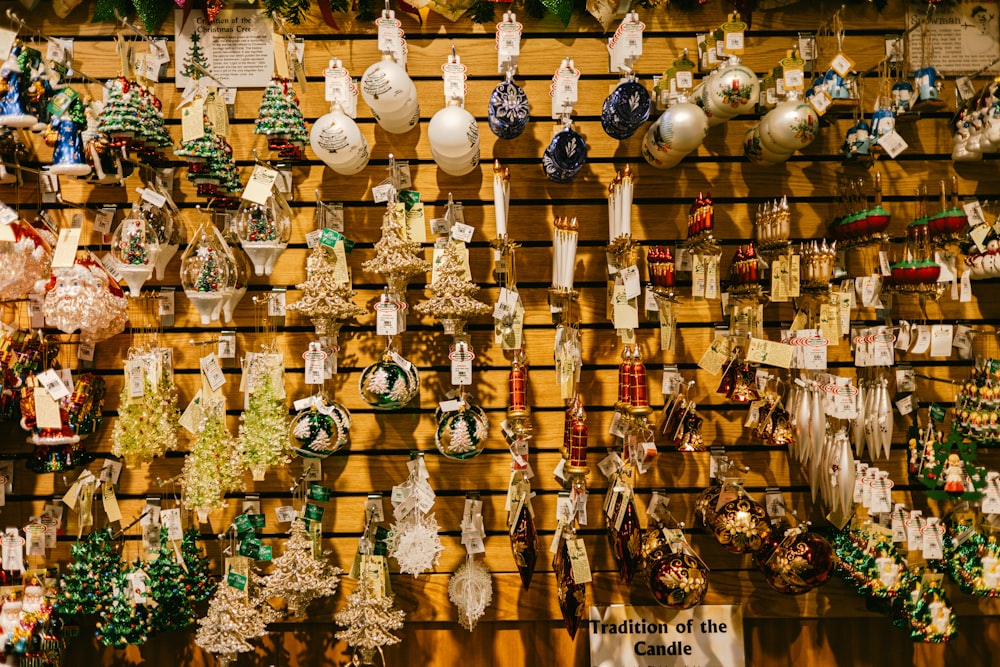 a display of christmas ornaments on a wooden wall