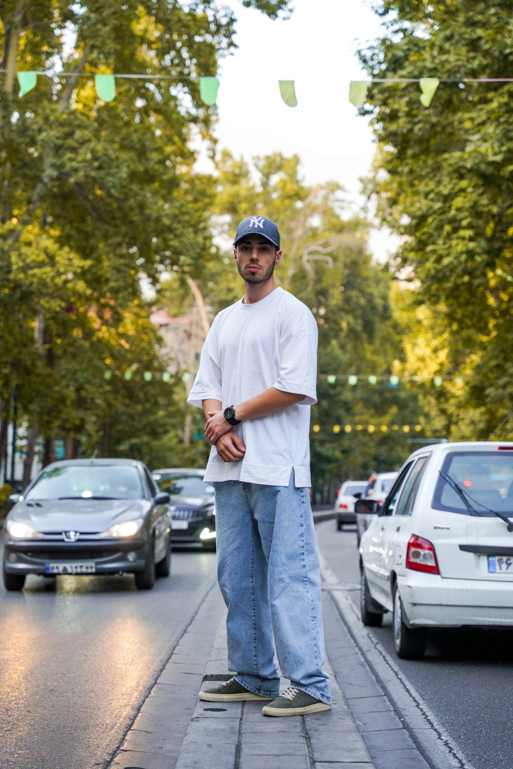 a man standing on the side of a street