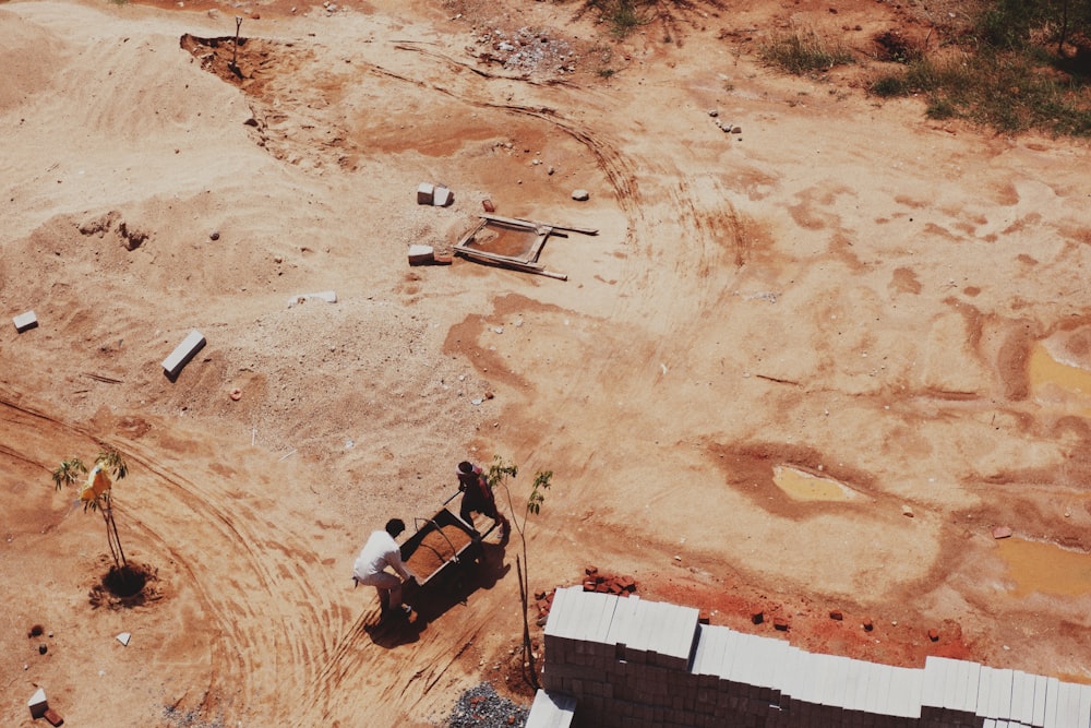an aerial view of a construction site with a truck in the foreground