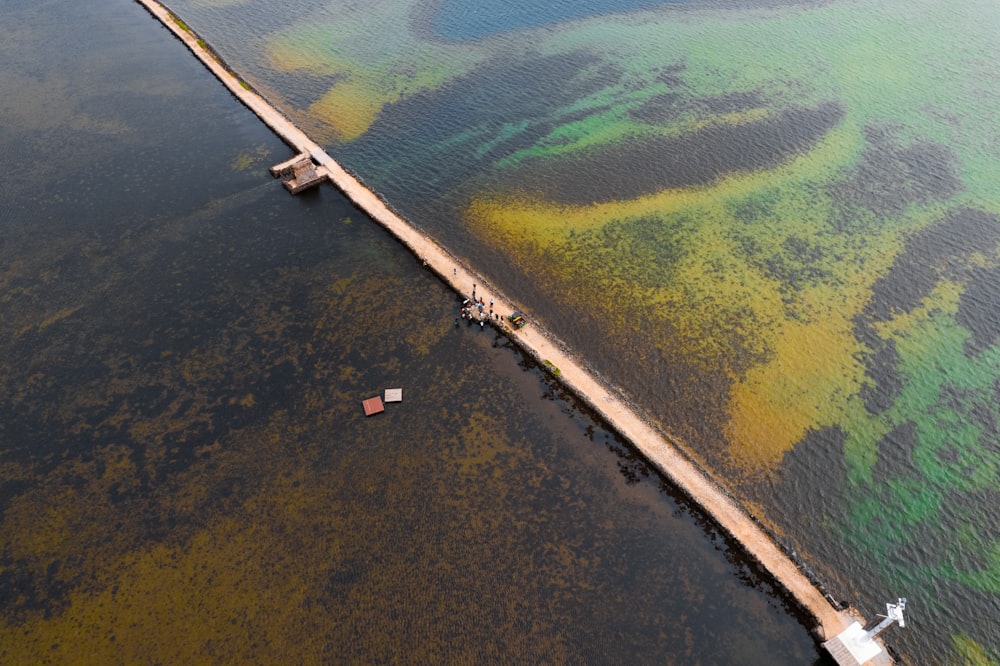 a large body of water with a bridge in the middle of it