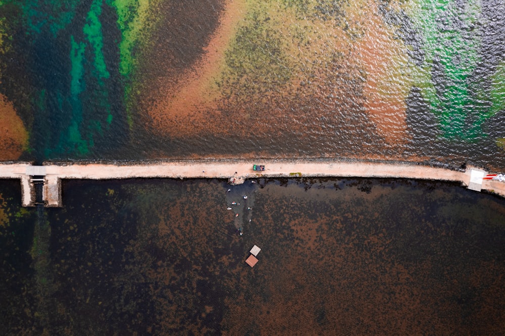 an aerial view of a bridge over a body of water