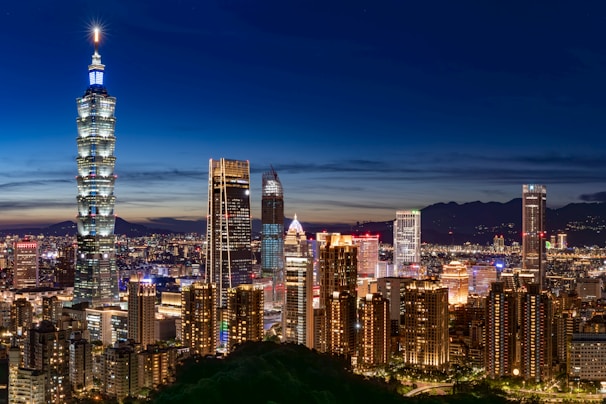 The bustling urban skyline of Mexico City framed by deep blue evening sky.