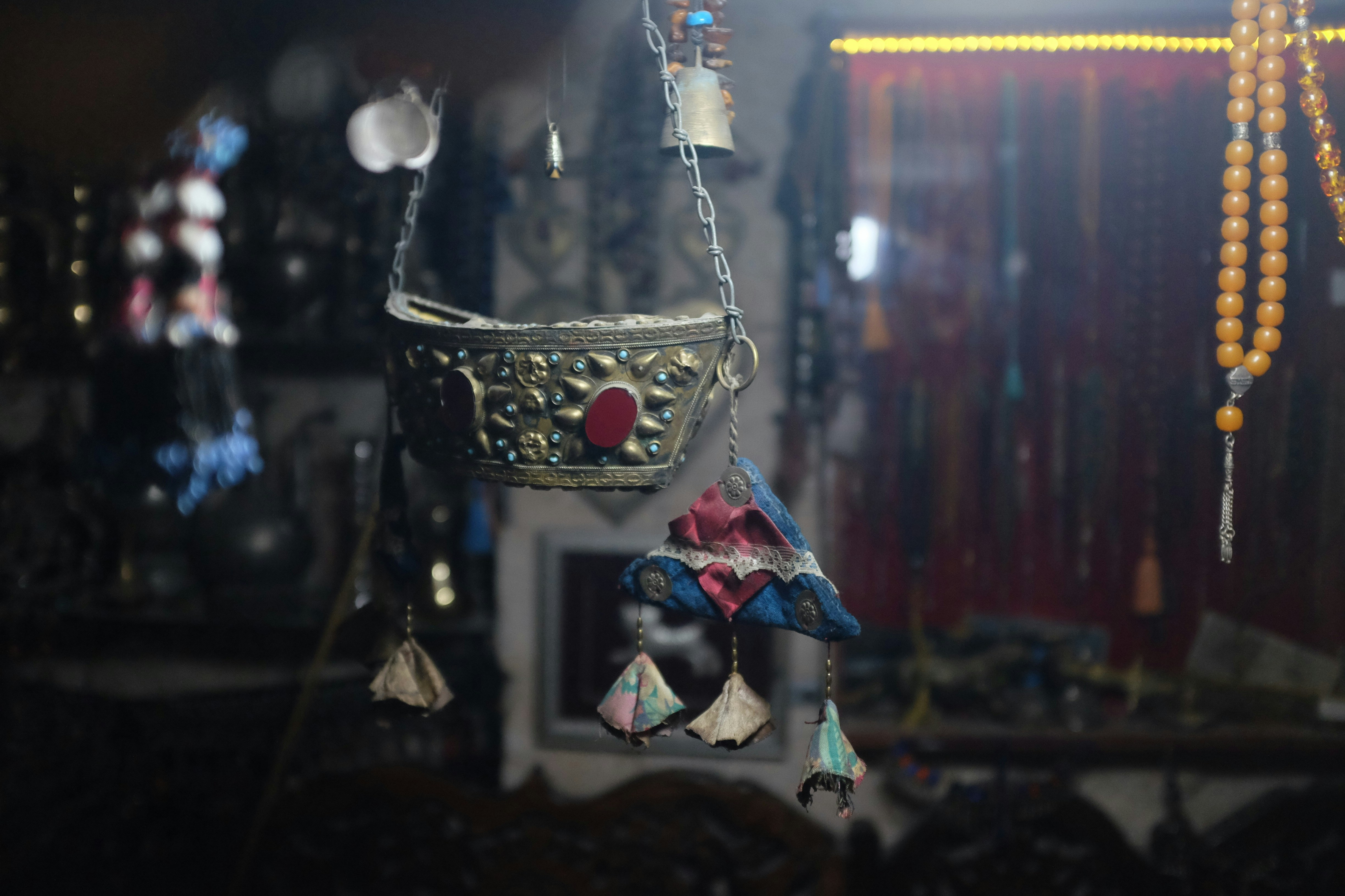 a close up of a metal object hanging from a ceiling