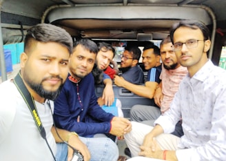 A group of travelers enjoying a ride in a spacious vehicle.