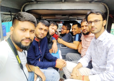 A group of travelers enjoying a ride in a spacious vehicle.