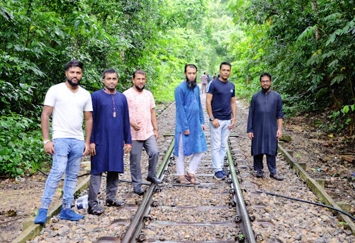 Group of railway employees celebrating a kabaddi victory with spirited camaraderie