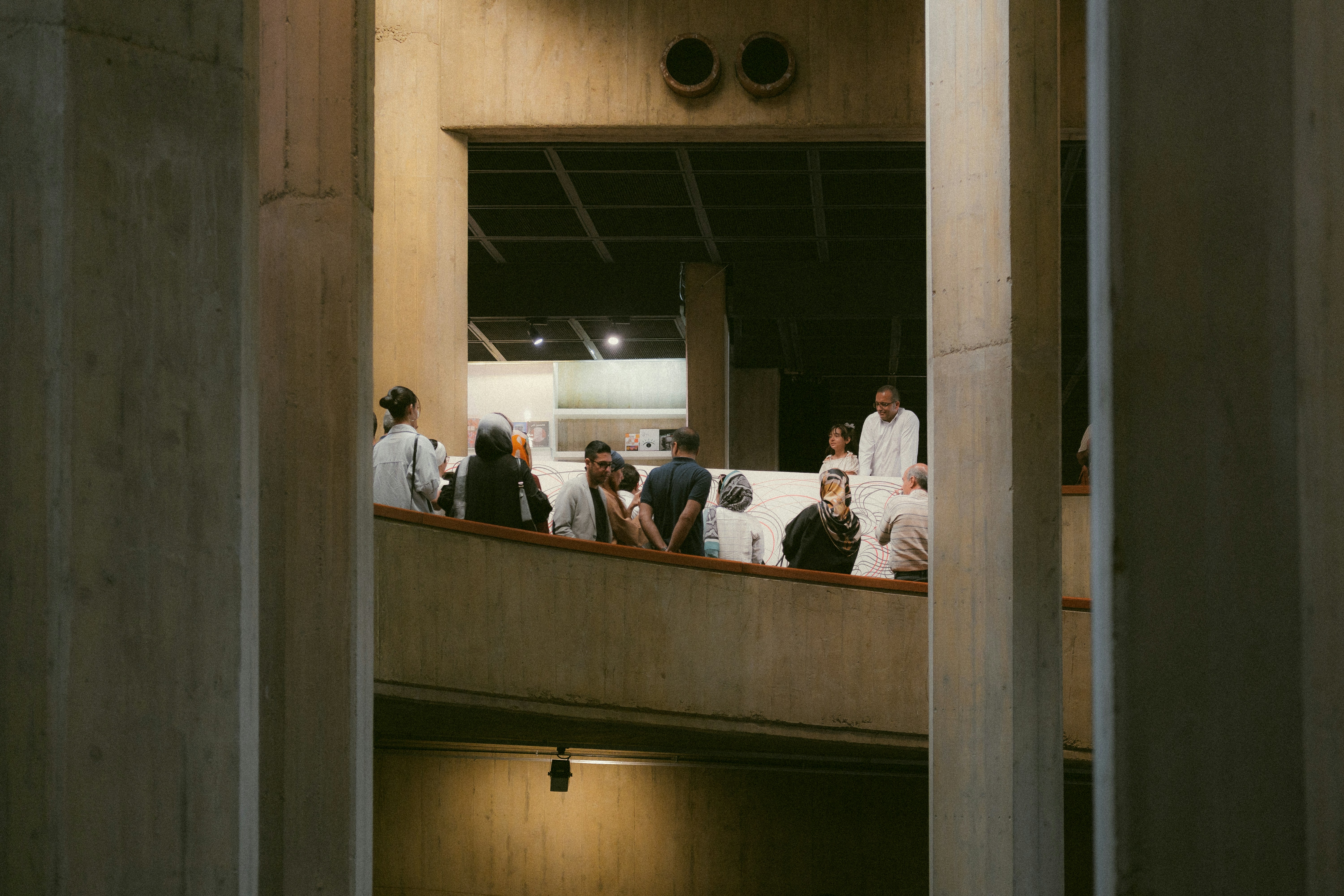 a group of people sitting at a table in a building