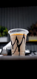 a plastic cup with a black and white design on it