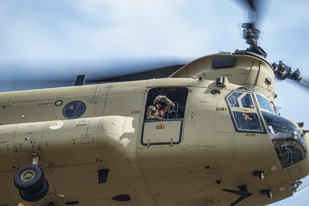 a close up of a helicopter with a person in the cockpit