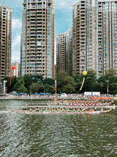 A vibrant dragon boat race with teams paddling fiercely under a bright sky.