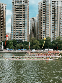 A vibrant dragon boat race with teams paddling fiercely under a bright sky.