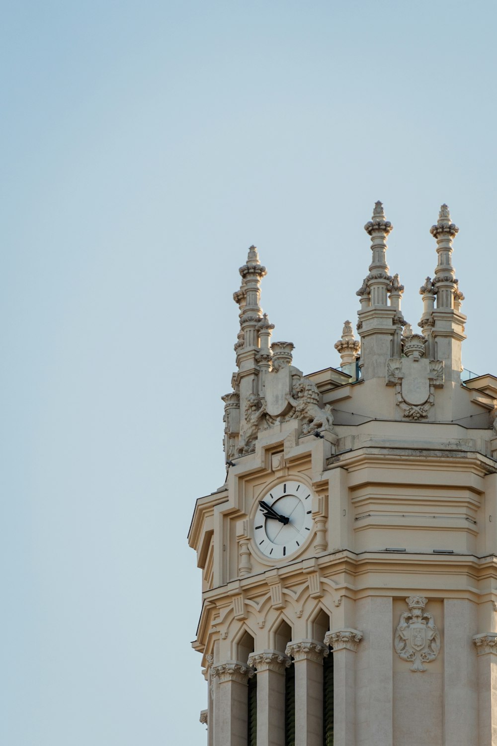 a large clock tower with a sky background