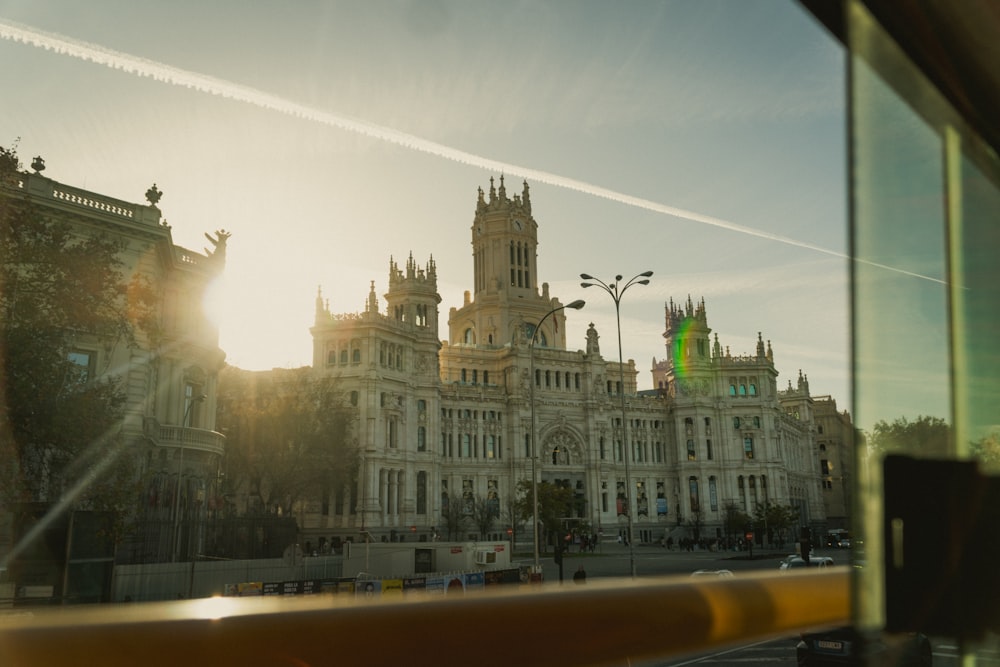 a view of a building from a bus window