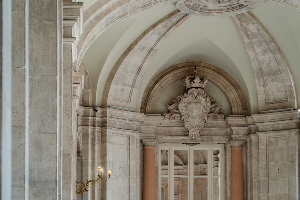 an ornate doorway in a building with a chandelier