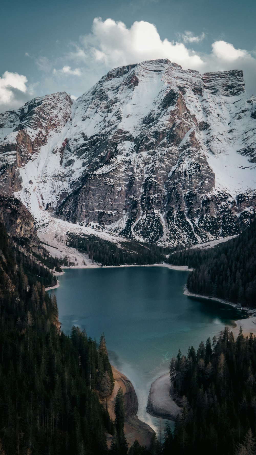 a mountain with a lake in the middle of it