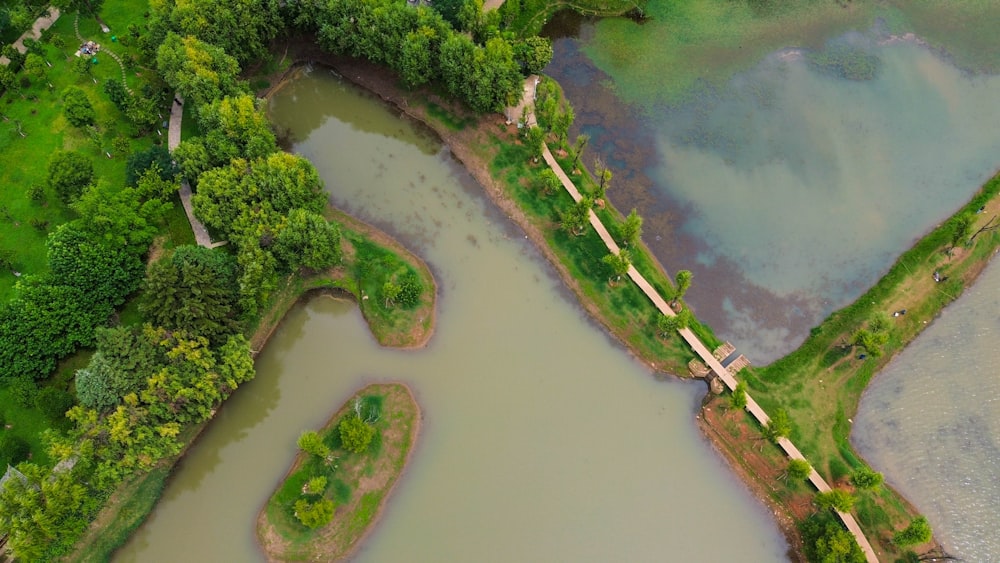 an aerial view of a river and a bridge