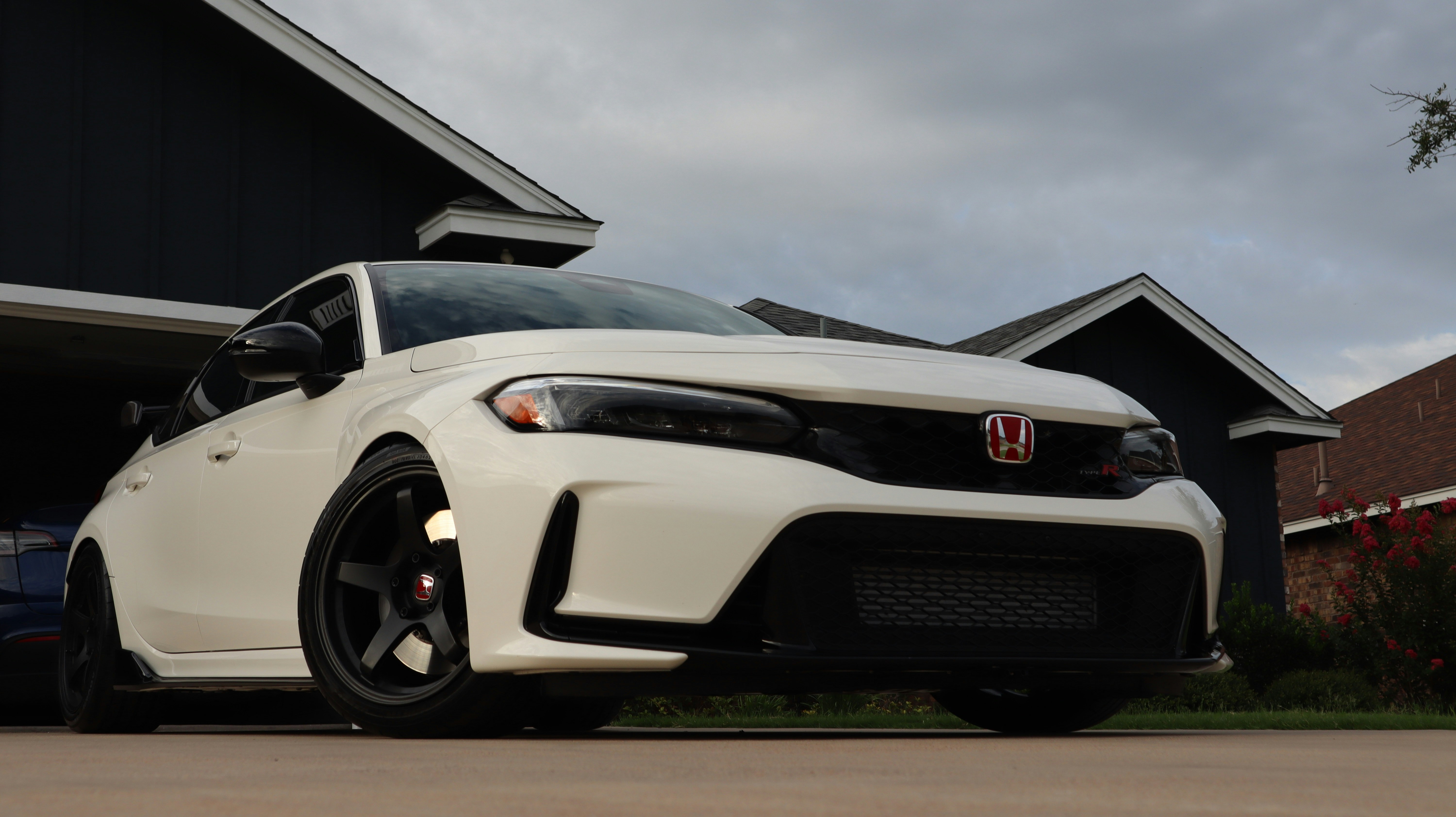A white car parked in front of a house photo – Free Machine Image on ...
