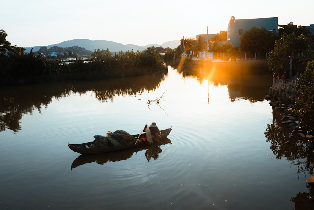 a couple of boats floating on top of a river